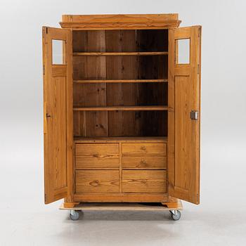 A pinewood cabinet, later part of the 19th Century.