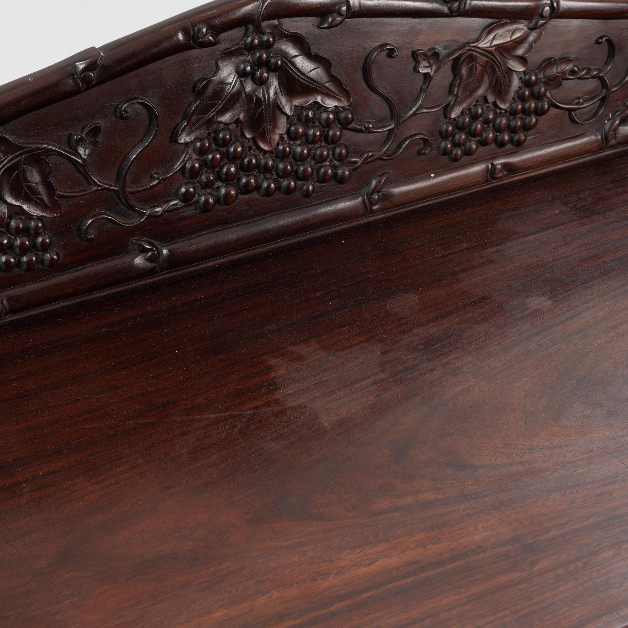 A Chinese hardwood shelf, 20th century.
