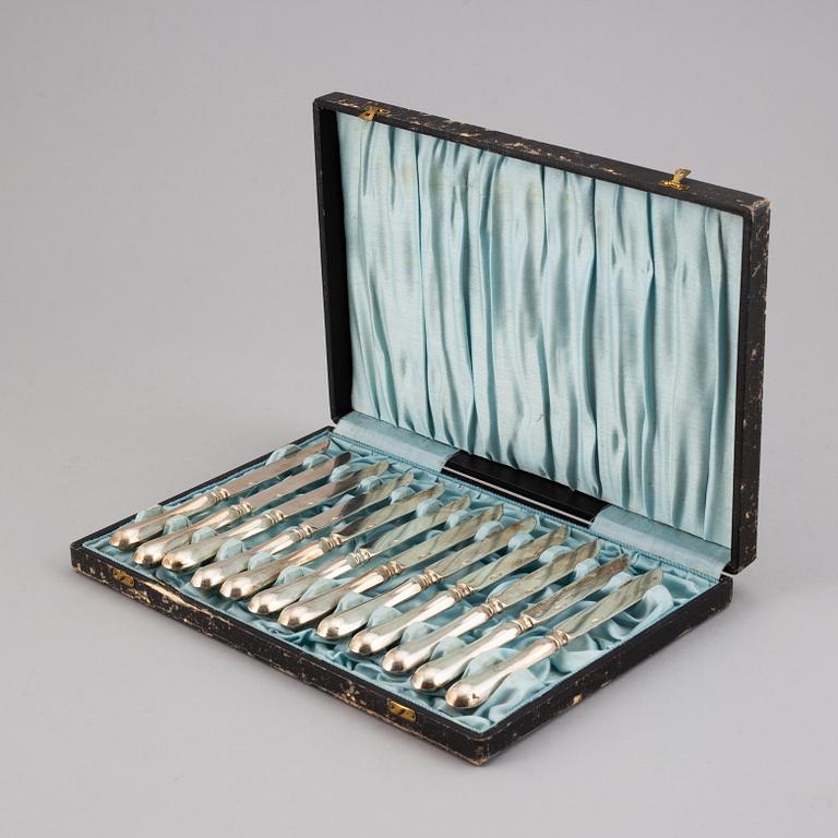A set of 12 Russian silver chees/fruit knives, mark possibly of Adolf Speer, St. Petersburg 1898-1903.