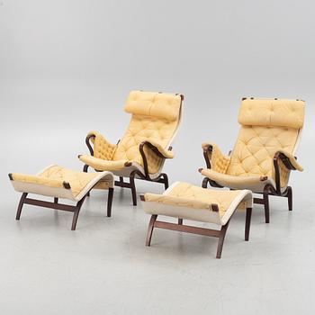 Bruno Mathsson, a pair of "Pernilla" armchair with ottoman, Dux, Sweden, second half of the 20th century.