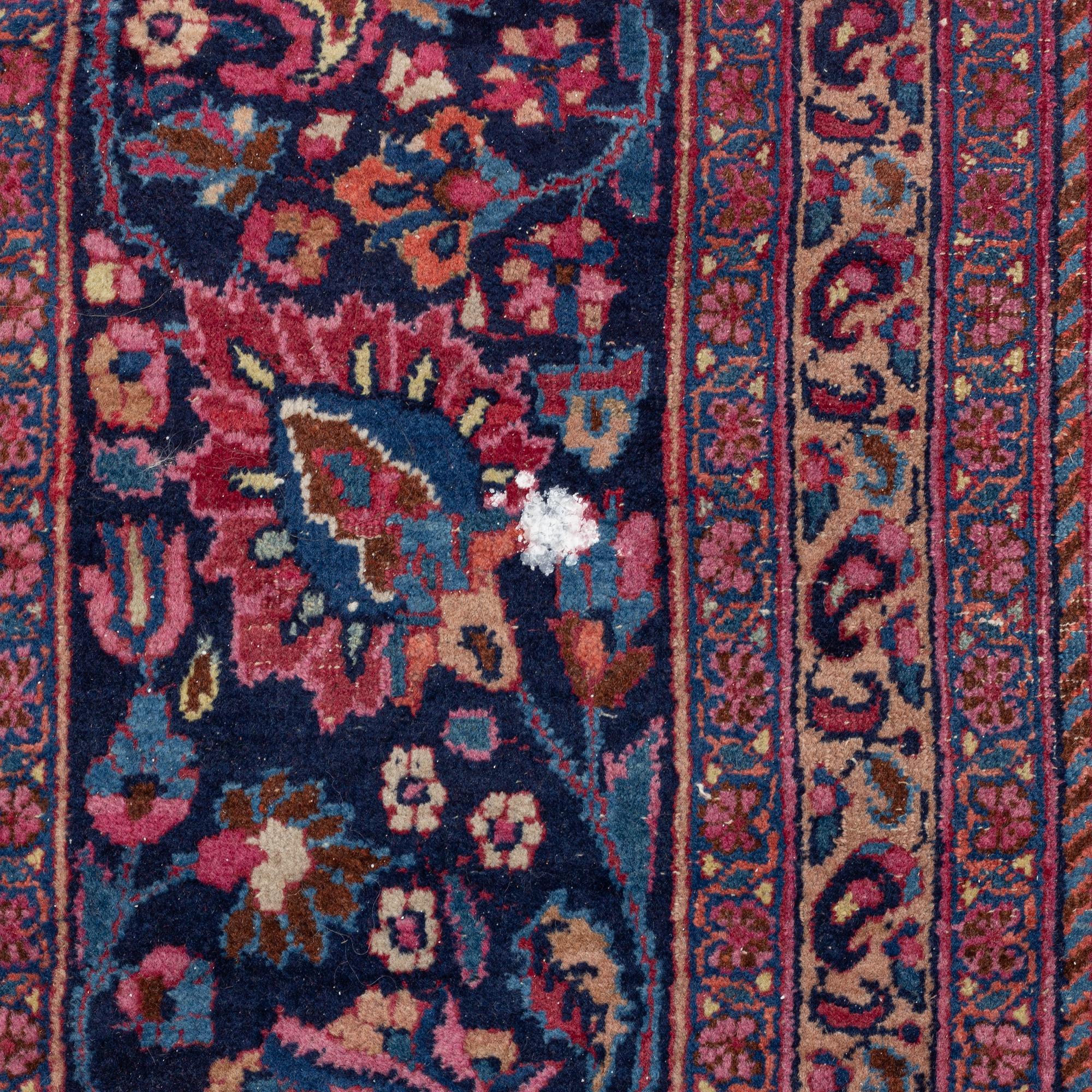 A Meshed carpet, c. 405 x 320 cm.