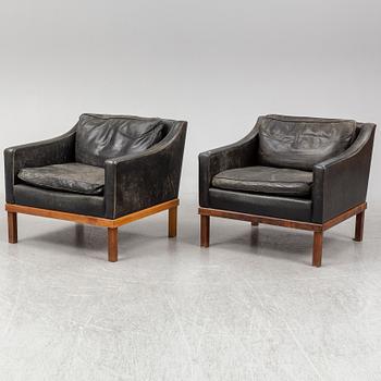 A pair of "The President" black leather armchairs by Ingemar Thillmark for OPE-möbler, Sweden.