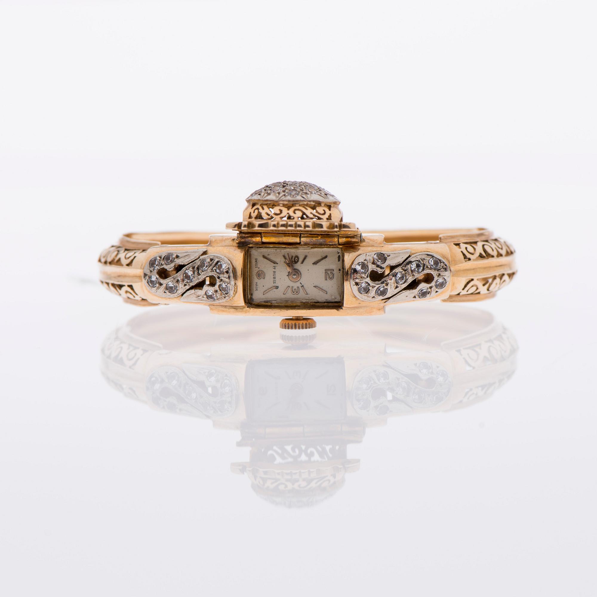 ARMBAND / ARMBANDSUR, 18K guld, åttkantslipade diamanter.