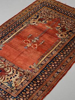 A rug, an antique silk Heriz, ca 166,5-170 cm x 116-120 cm.