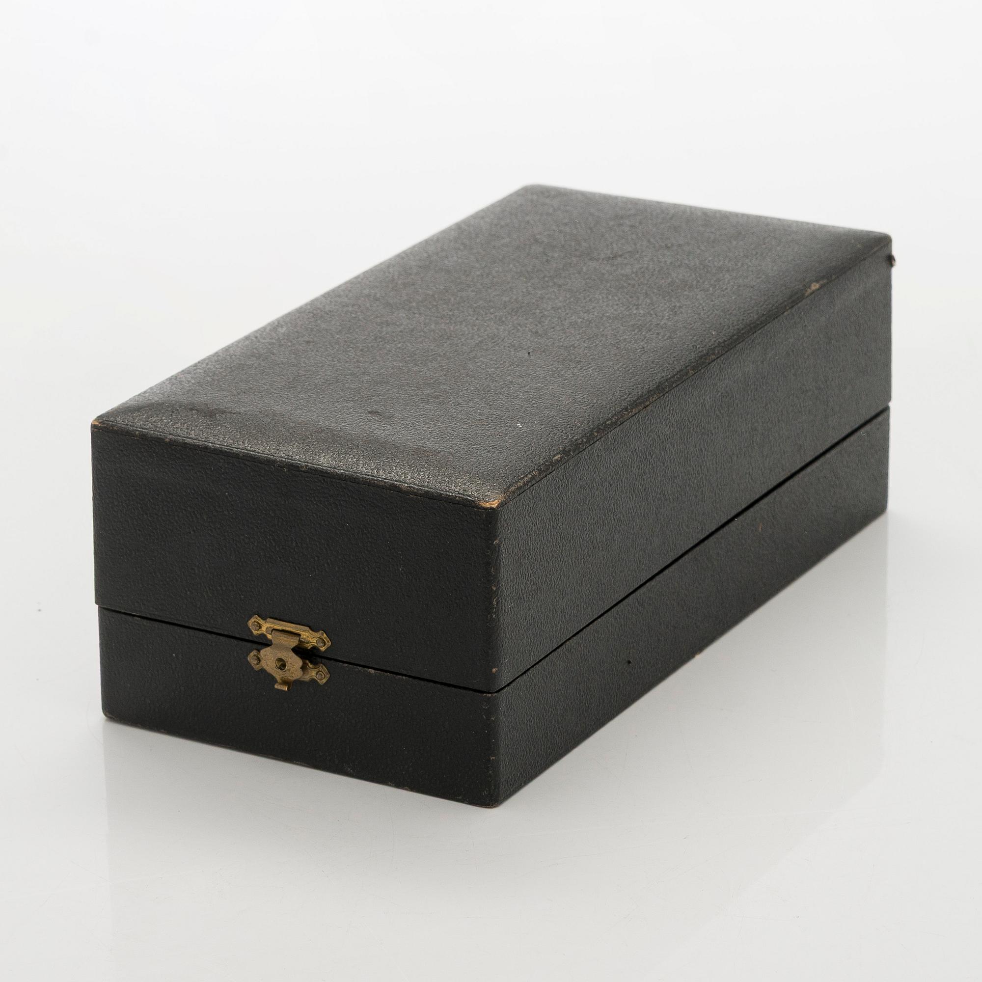 A 12-piece set of silver glass coasters, Kultakeskus, Hämeenlinna 1952. In original fitted case.