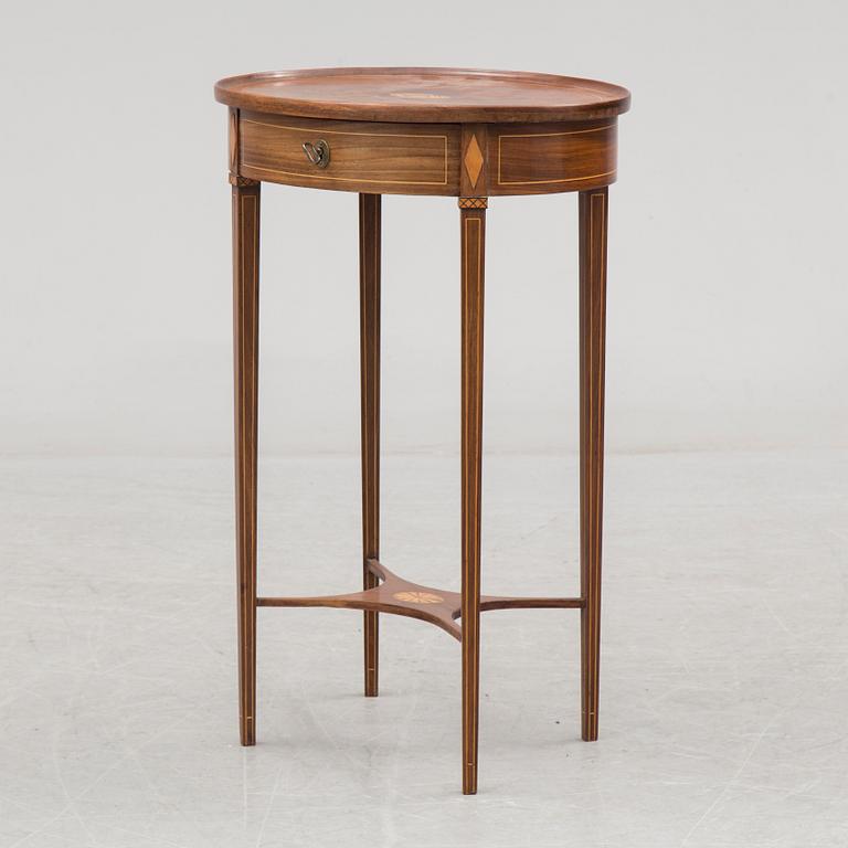 An early 19th century mahogany veneered table.