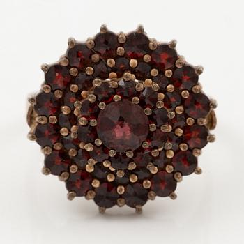 Garniture, two rings, brooch, two necklaces, and two pairs of earrings, armlet, garnets.