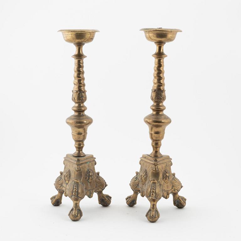 A pair of Baroque-style bronze candlesticks, 19th Century.