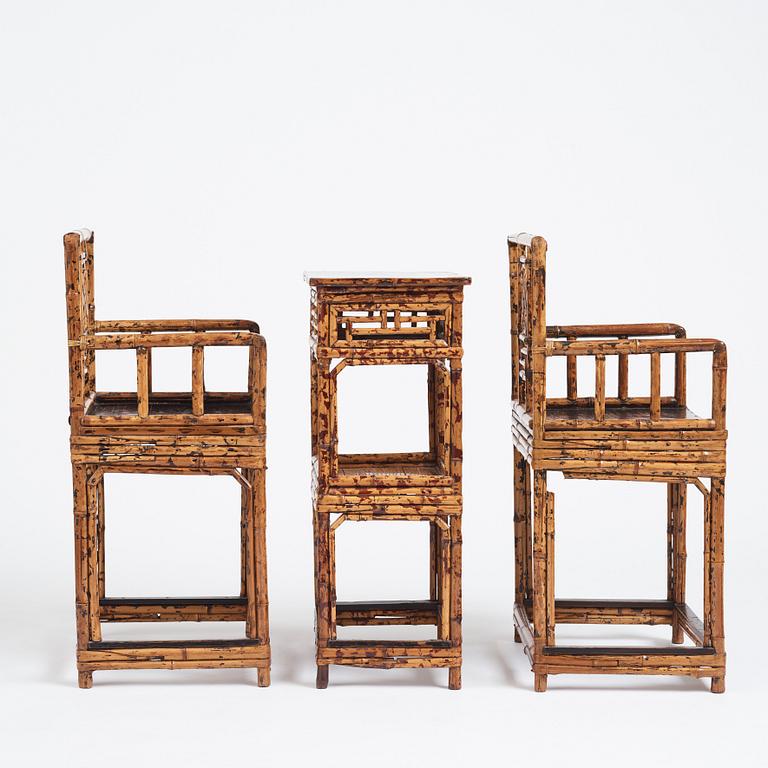 A pair of spotted bamboo chairs and a table, Qing dynasty, 19th Century.