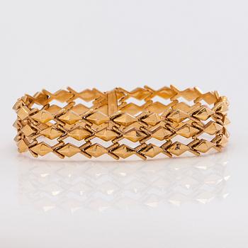 A 14K gold bracelet.