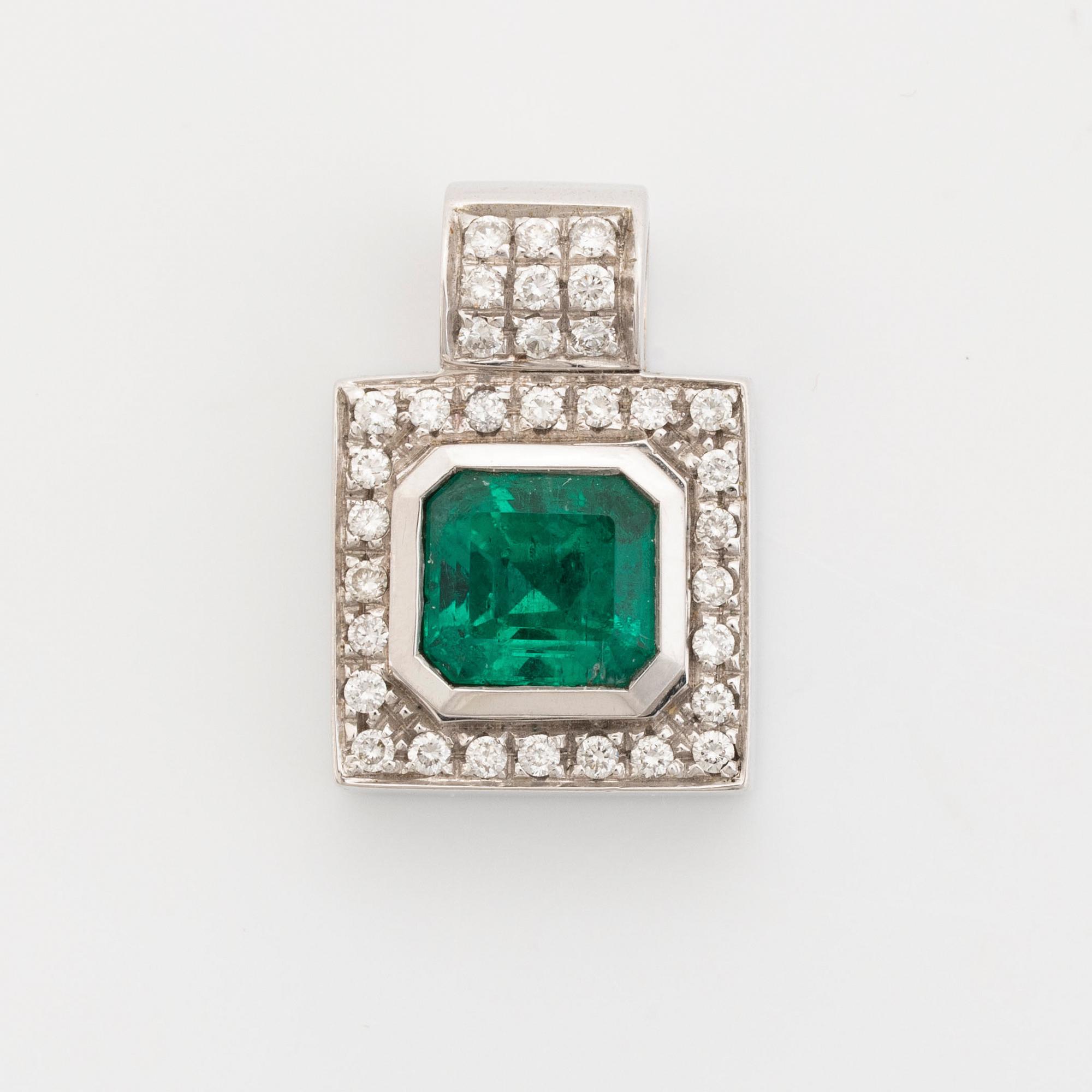 Emerald cut emerald and brilliant cut diamond pendant.