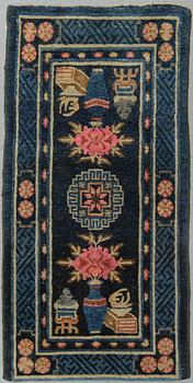 A rug, semi-antique, Baotou, ca 129 x 66 cm.