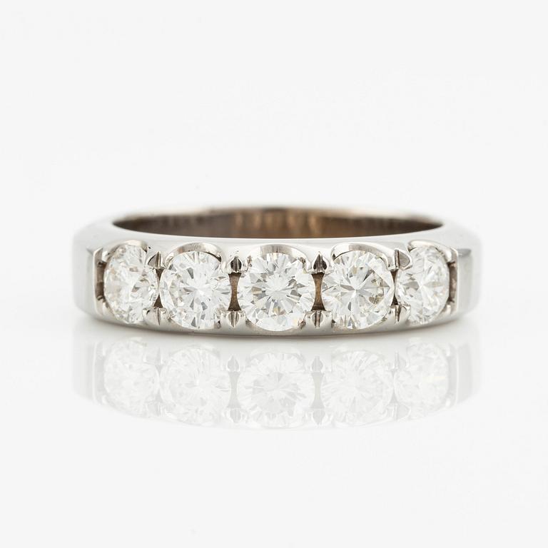 Ring with five brilliant-cut diamonds.