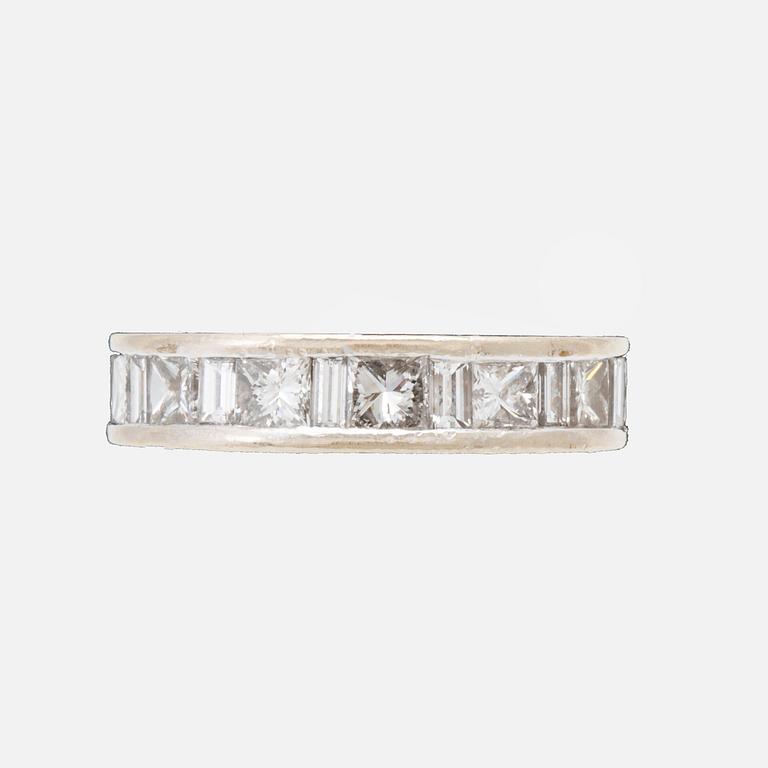 An 18K white gold eternity ring set with baguette and princess cut diamonds by Hartmann's Denmark.