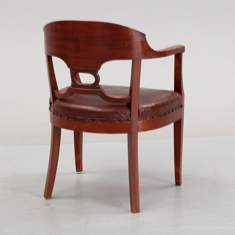 An Empire style writing desk, first half of/mid 20th century, and an Empire style chair, early 20th century.