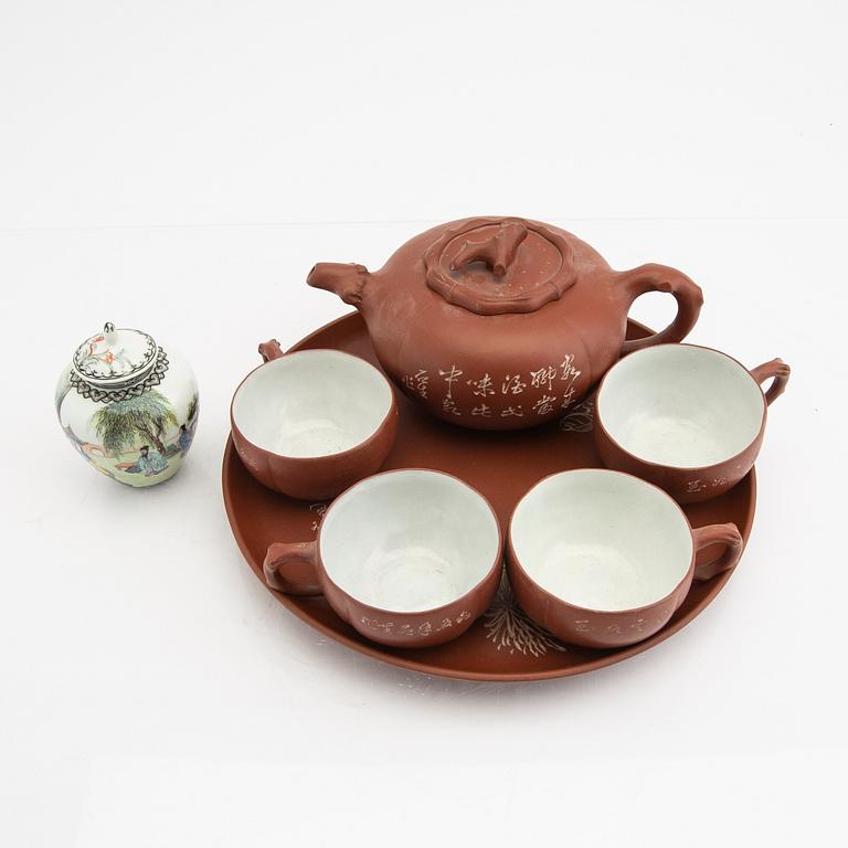 A Chinese 20th century Yixing ware tea service and a porcelain tea caddie.