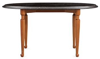A Josef Frank black marble top and mahogany table by Svenskt Tenn.