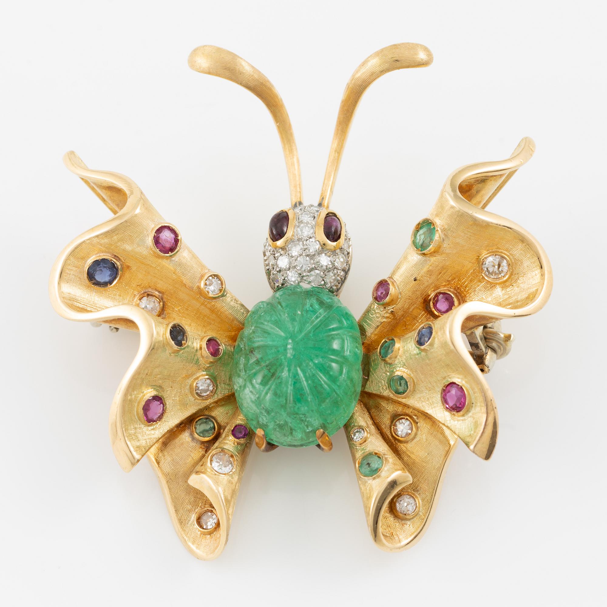 Brooch in the form of a butterfly, 14K gold with carved emerald, sapphires, emeralds, rubies, and diamonds. Second half of the 20th century.