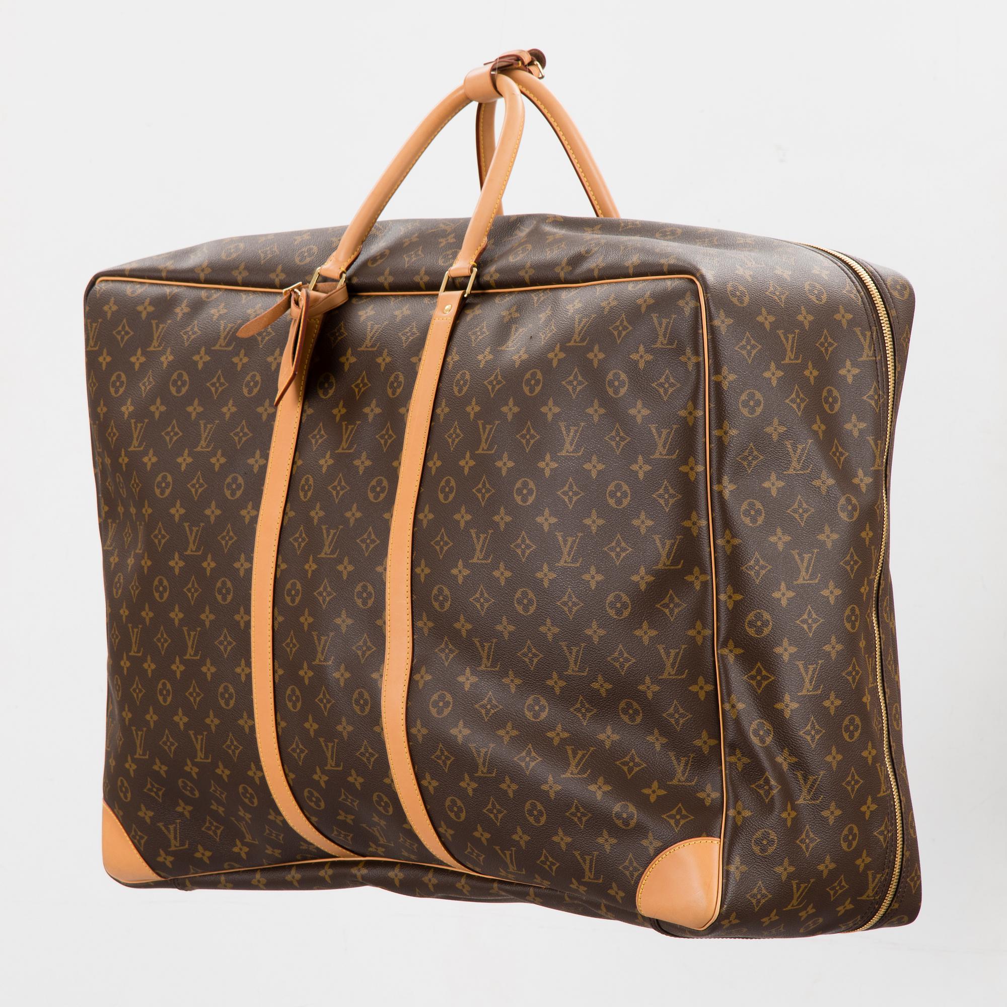 A Monogram Canvas Sirius 70 Suitcase. - Bukowskis