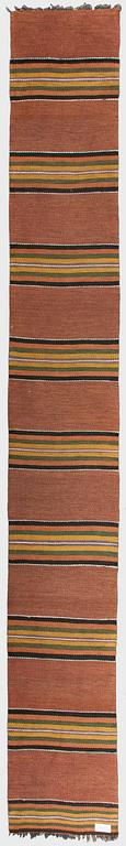 A 1930/1940s rag rug /runner. Circa 550 x 74 cm.