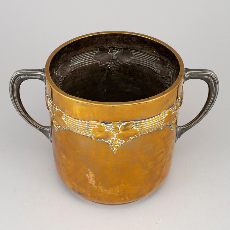 An art nouveau brass champagne cooler, early 20th century.