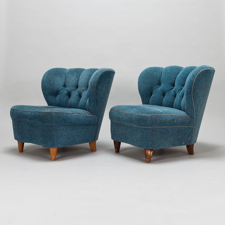 A pair of mid-20th-century armchairs.
