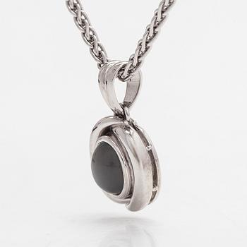 An 18K white gold necklace, with an oval cabochon-cut moonstone. Gallopin & Cie, Geneva.