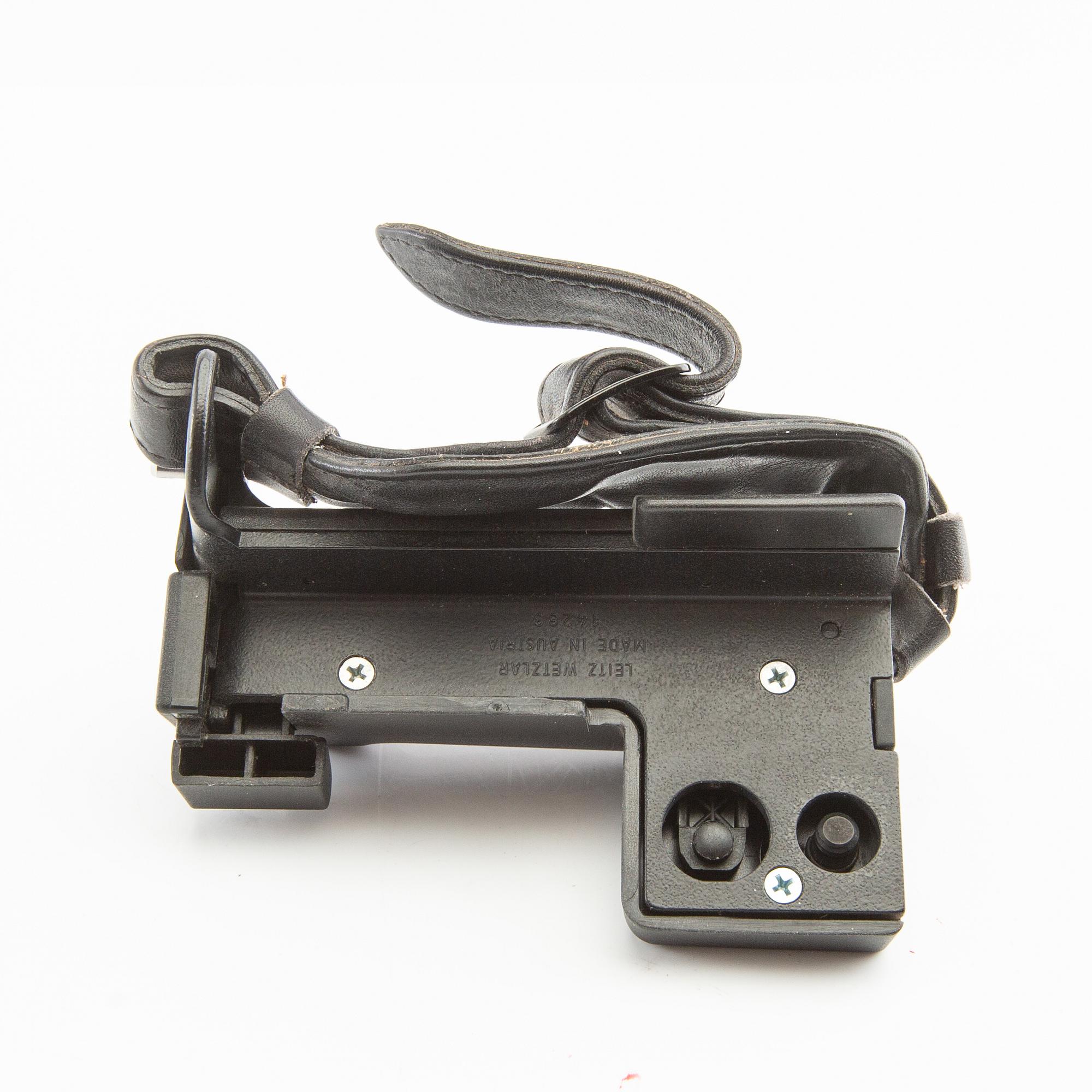 Leica R4s camera body, lens, and accessories.