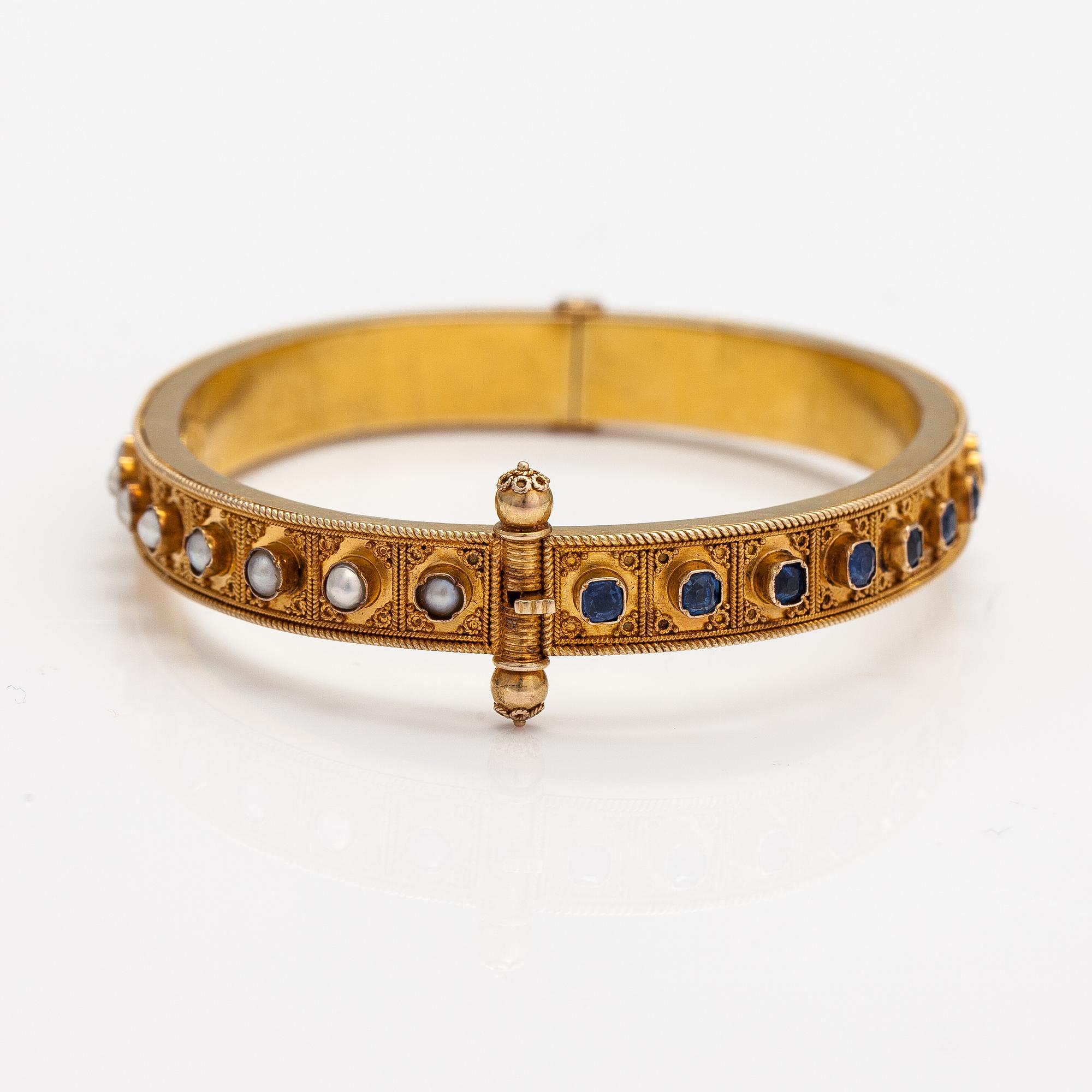 A ca. 22K gold bracelet with sapphires and pearls. Marchesini, Firenze Roma.
