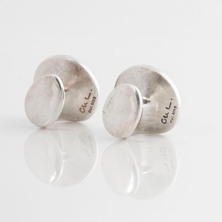A pair of cufflink, by Ole Lynggaard.