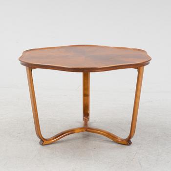 A 1940s mahogany coffee table.