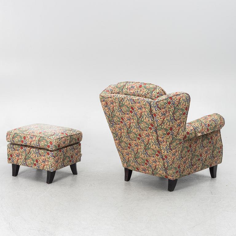 A "Djursholm" armchair with ottoman, Sweden, early 21st century.