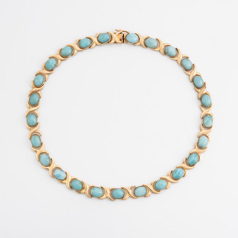 14K gold necklace and ring, with cabochon cut blue stones.
