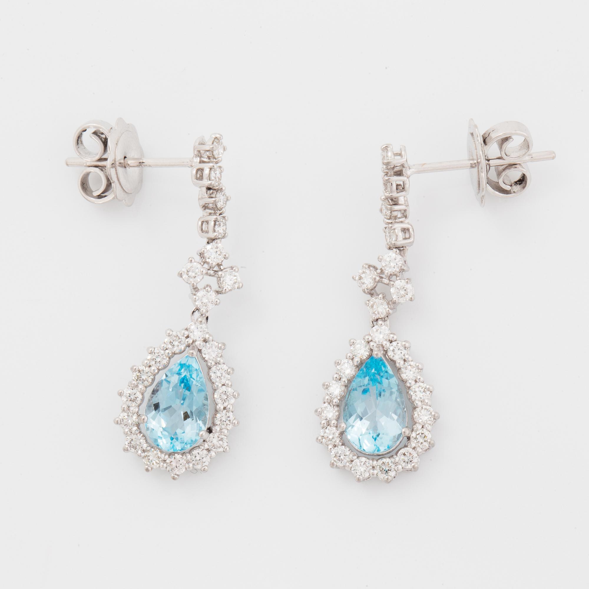 Topaz and brilliant-cut diamond earrings.