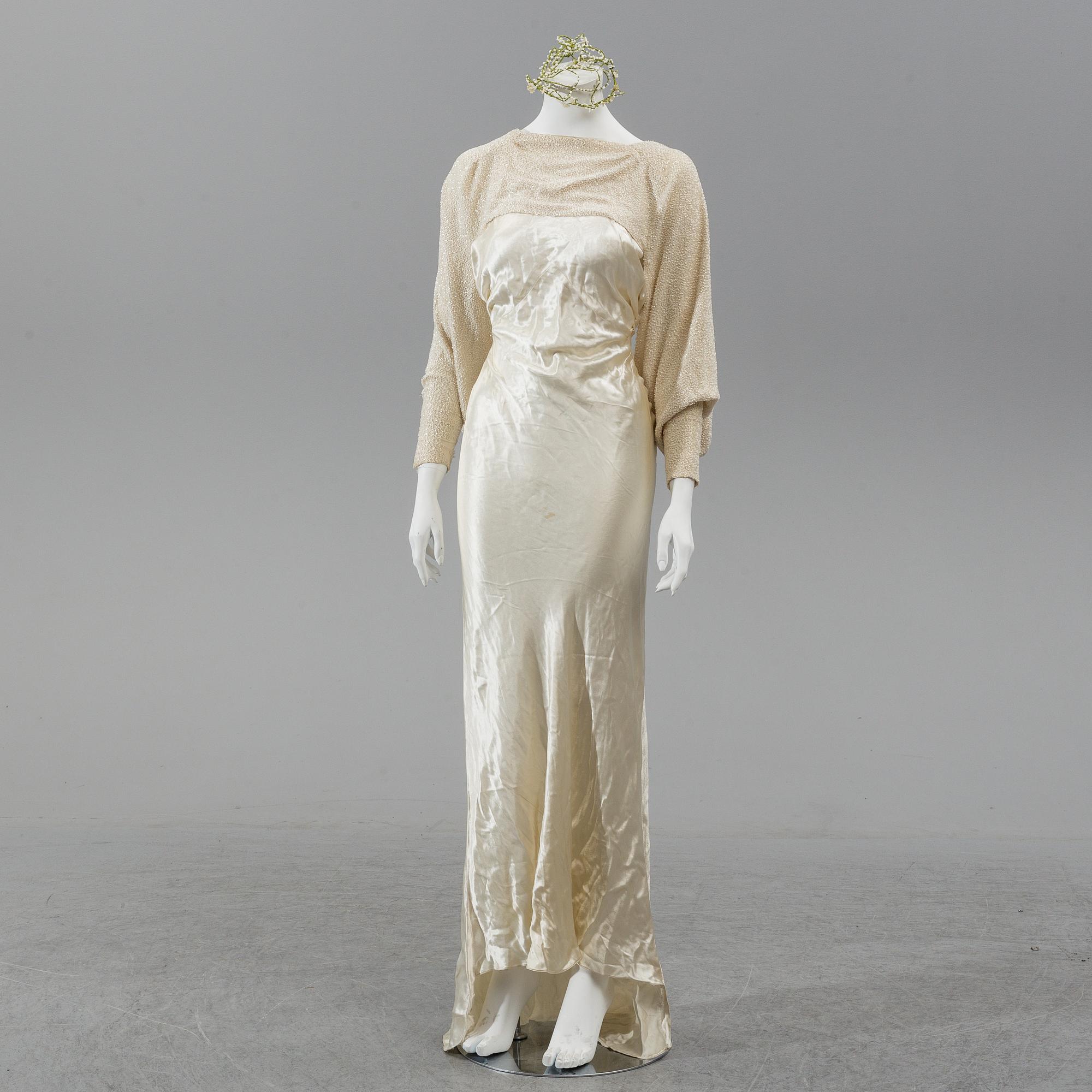 A satin wedding dress, circa 1935.