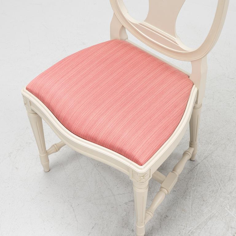 A Gustavian style table with four chairs, second half of the 20th century.