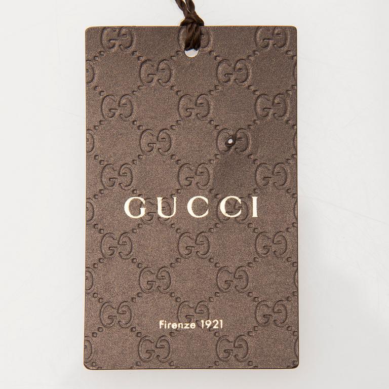A pair of Gucci ladies' leather gloves.