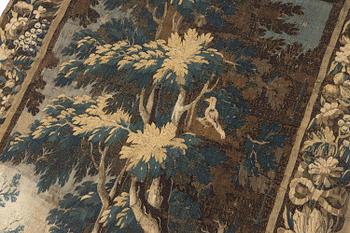 A 17th century Flemish 'verdur' entre-fenêtre tapestry, c. 268 x 130 cm.
