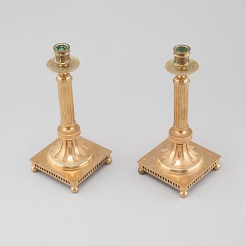 A pair of gustavian style brass candle sticks by Grillby Metal factory, Sweden, first half of the 20th century.