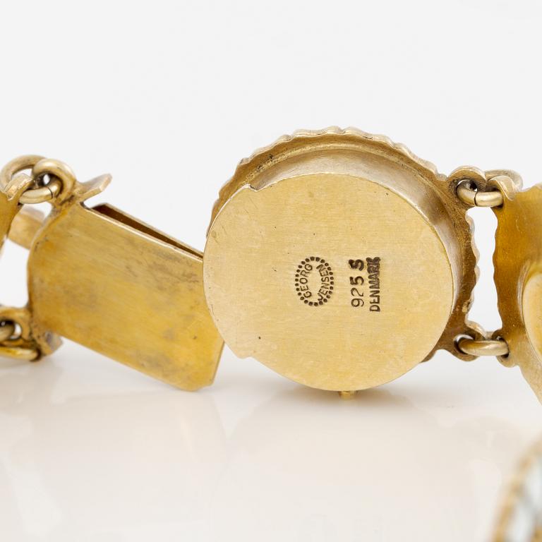 Georg Jensen and A Michelsen "Daisy" a bracelet, a pendant, and a brooch silver gilt and enamel.