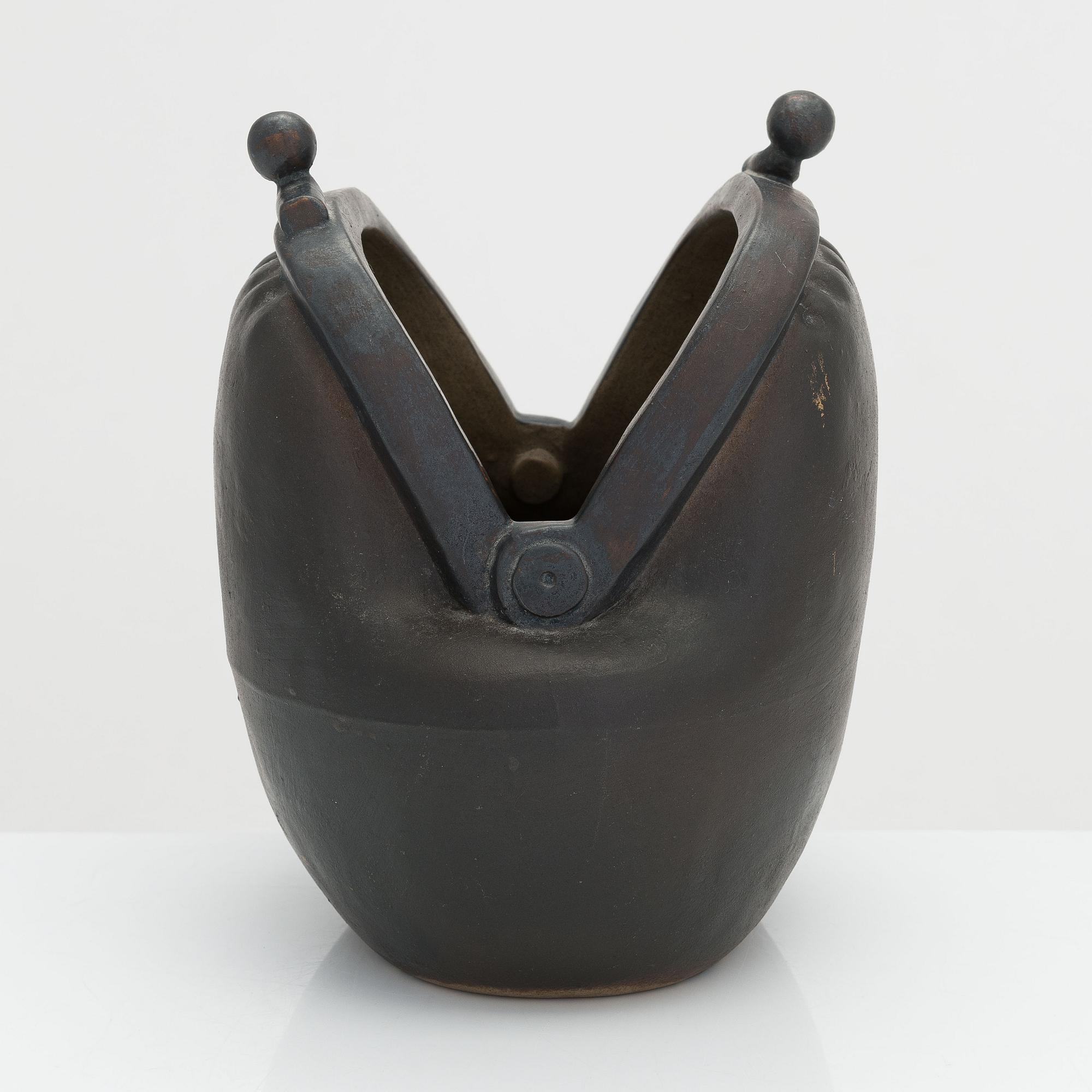 Outi Leinonen, a ceramic vase formed as a purse for Pentik, Finland.