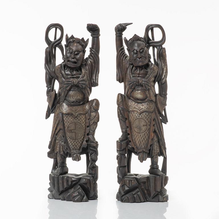 A pair of Chinese hardwood figures, 20th century.