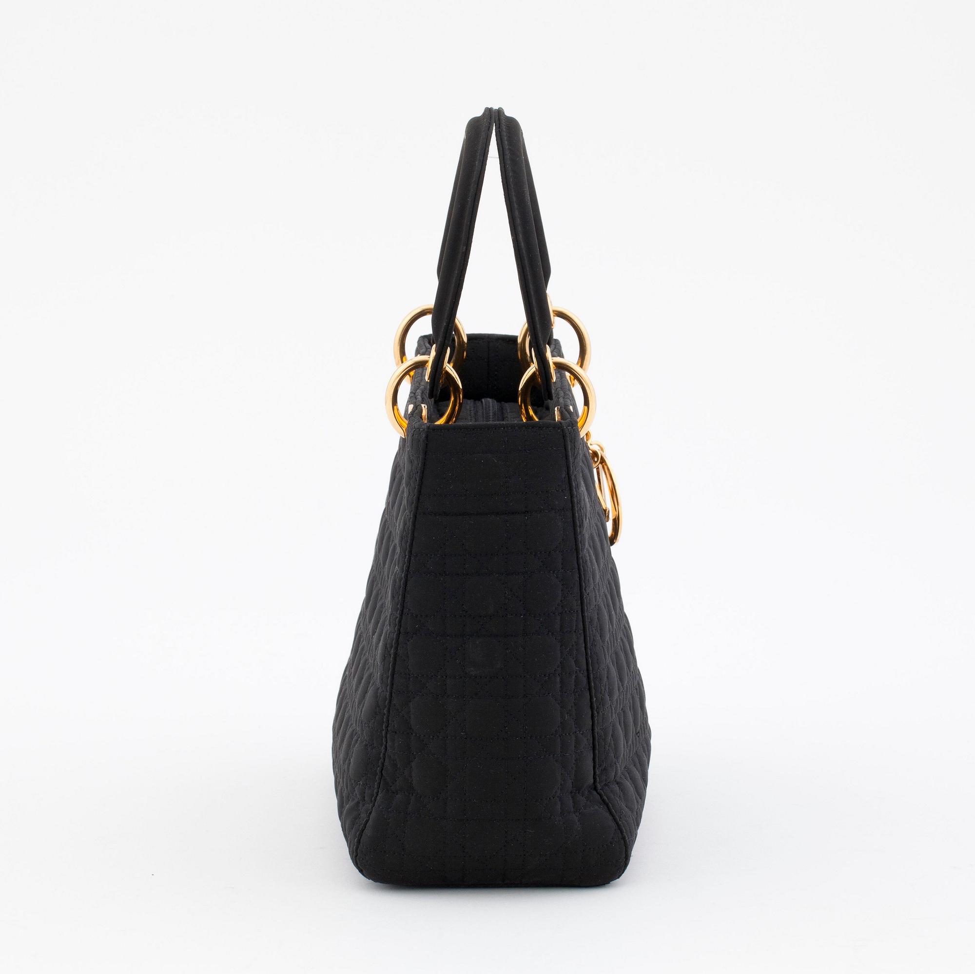 CHRISTIAN DIOR, a black silk blend handbag, "Lady Dior".