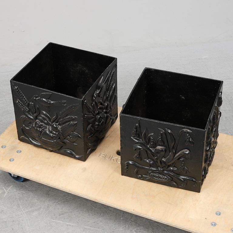 A pair of cast iron garden plant pots, 20th Century.
