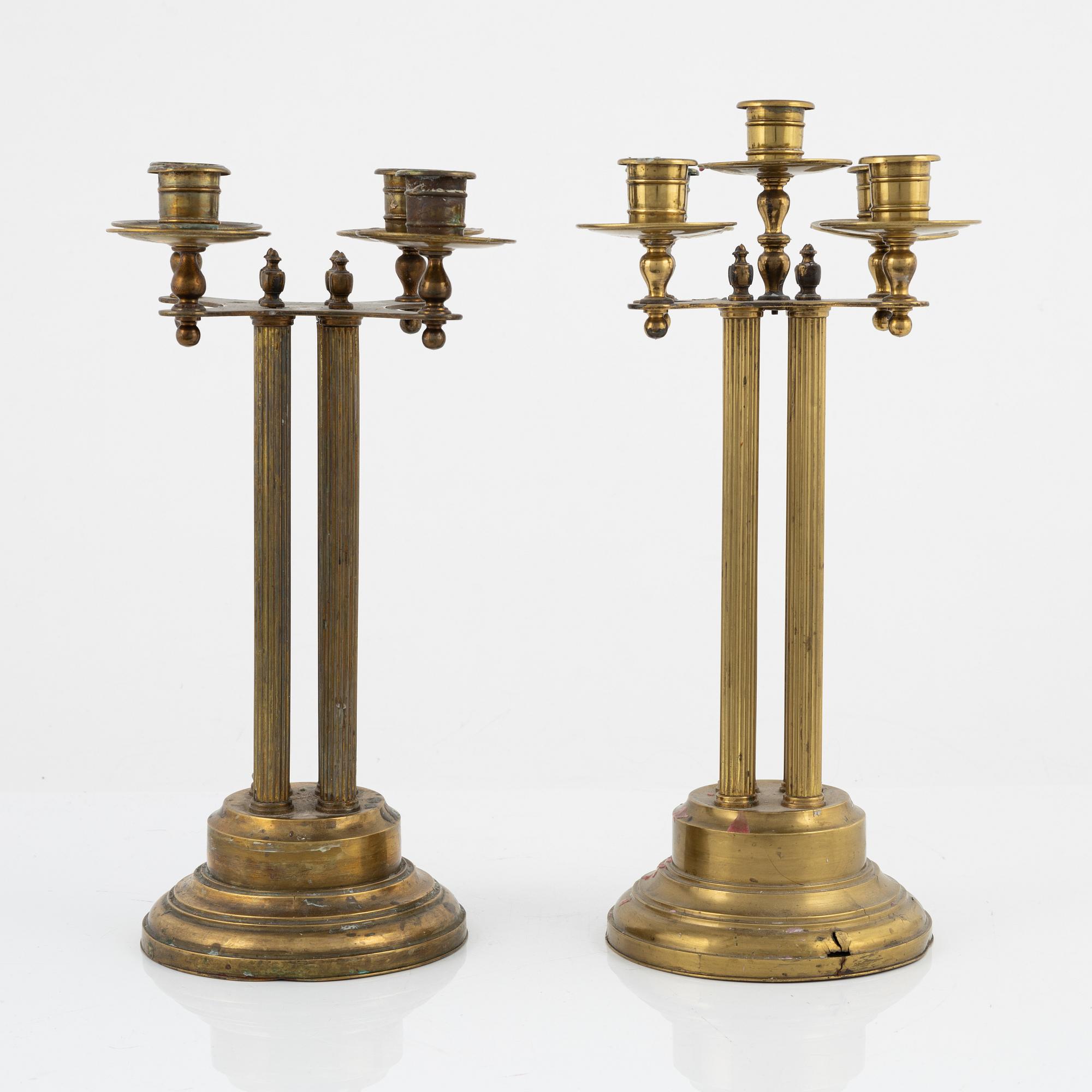 A pair of brass candelabras, first half of the 20th century.