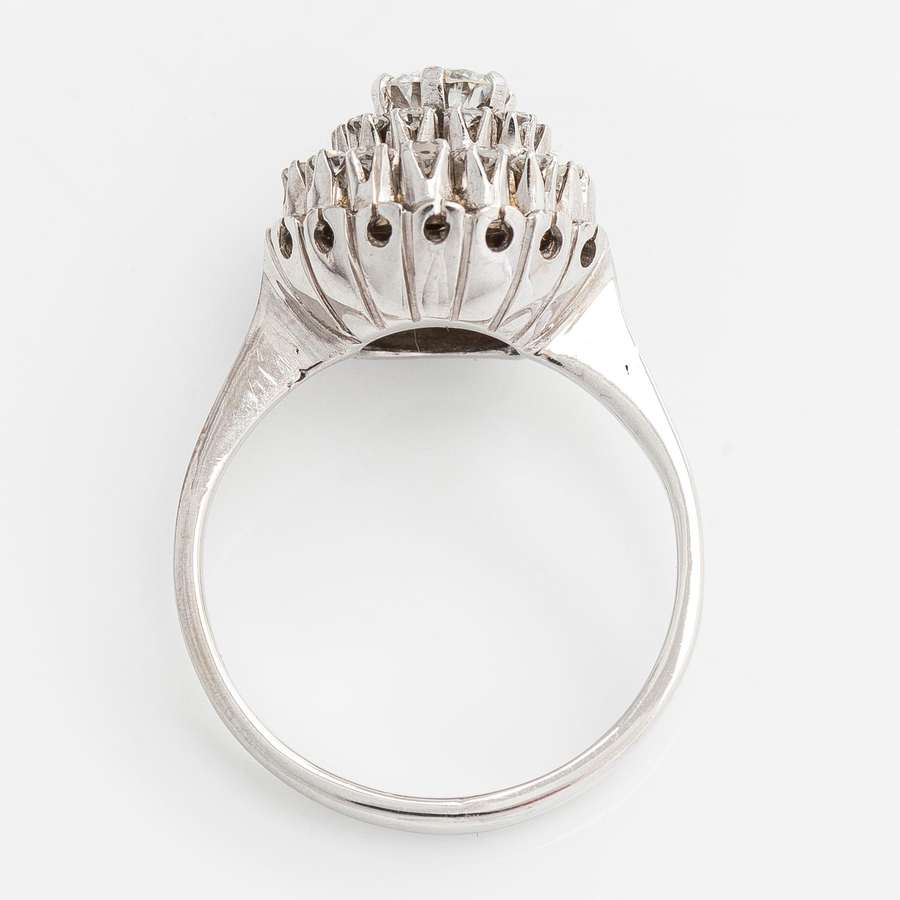 An 18K whitegold cluster ring set with a brilliant- and single-cut diamonds.