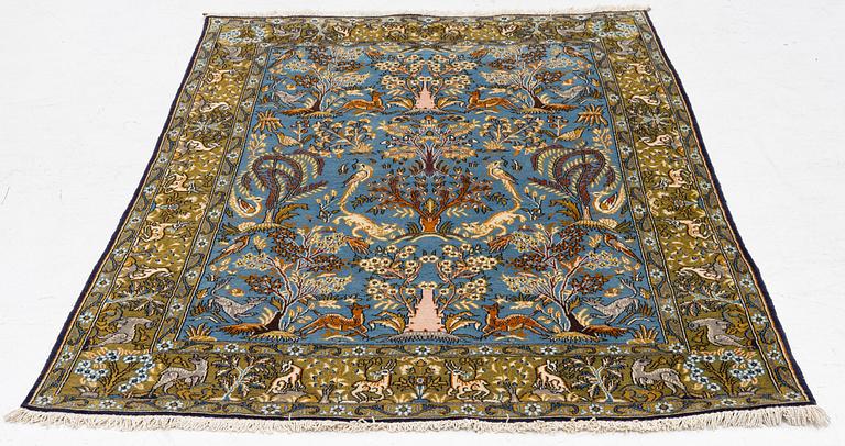 A Ghom figural rug, c. 202 x 132 cm.