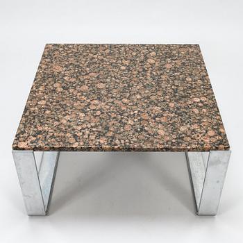 A chromed steel and polished granite coffee table, latter half of the 20th century.