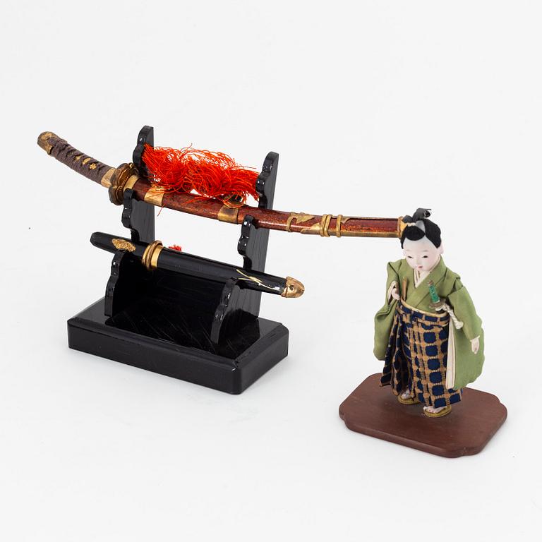 A group of Japanese lacquered objects in wooden crates, early 20th Century.