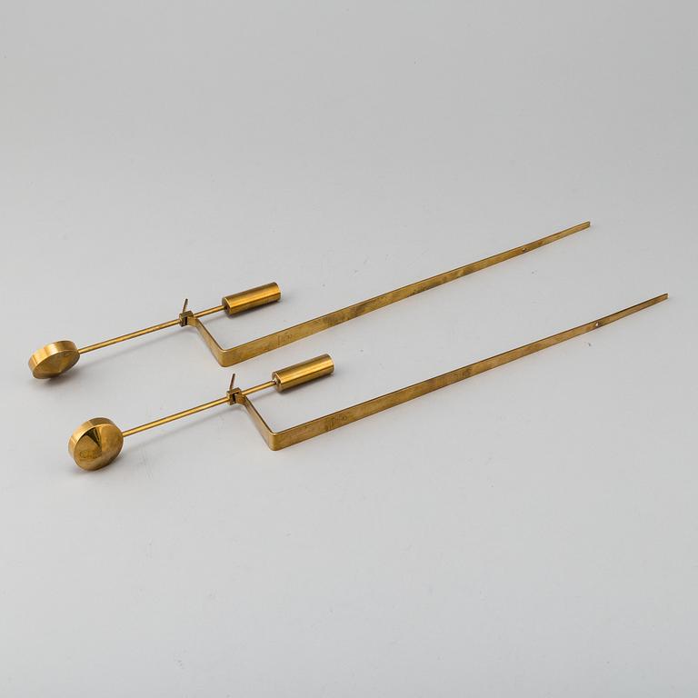 PIERRE FORSSELL, "Pendeln", a pair, brass, Skultuna. Second half of the 20th century.